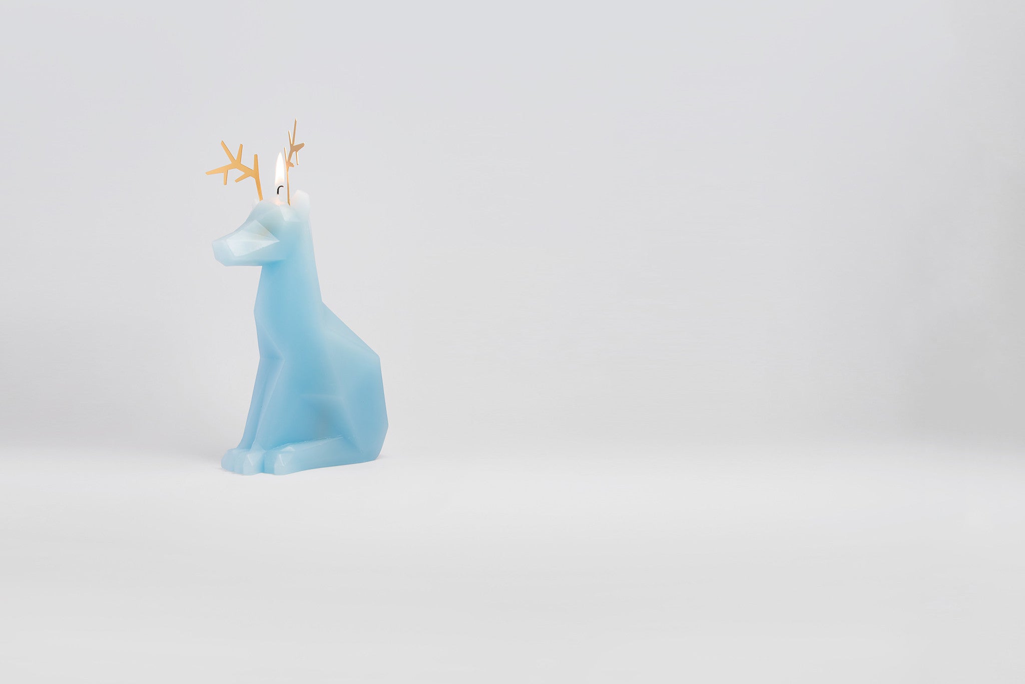 Light blue Dyri the Reindeer shaped candle burns to reveal inner pyropet skeleton. 